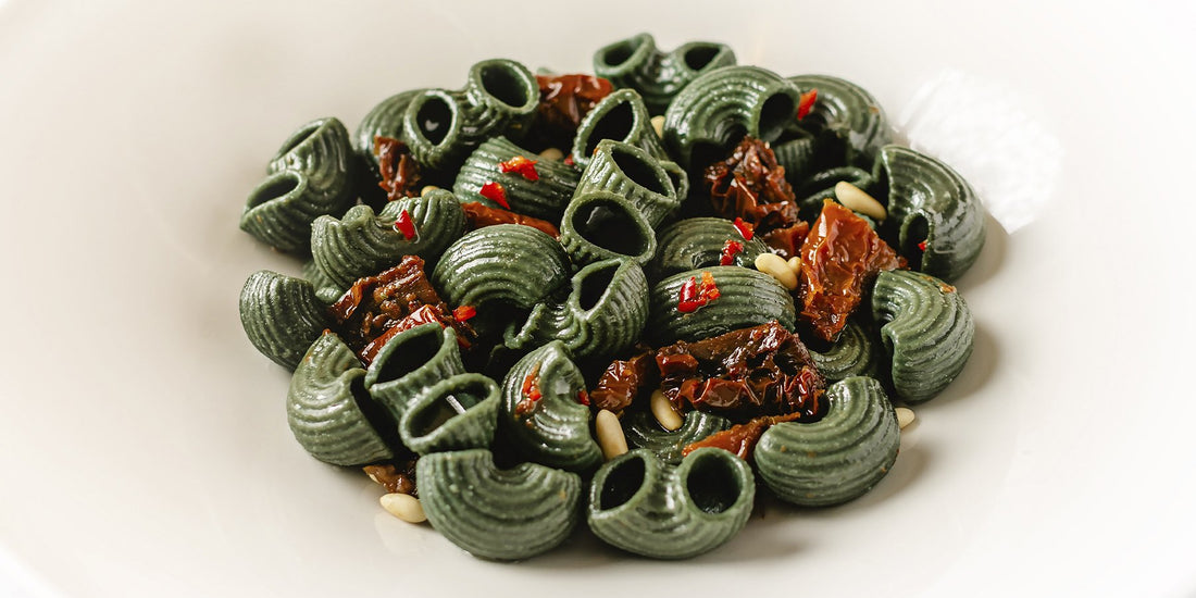 White Corn and Spirulina Pipe Rigate with Spicy Oil, Sundried Tomatoes and Pine Nuts